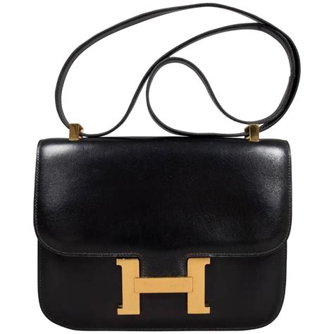 hermes black shoulder bag with large h clasp|hermes shoulder bag men.